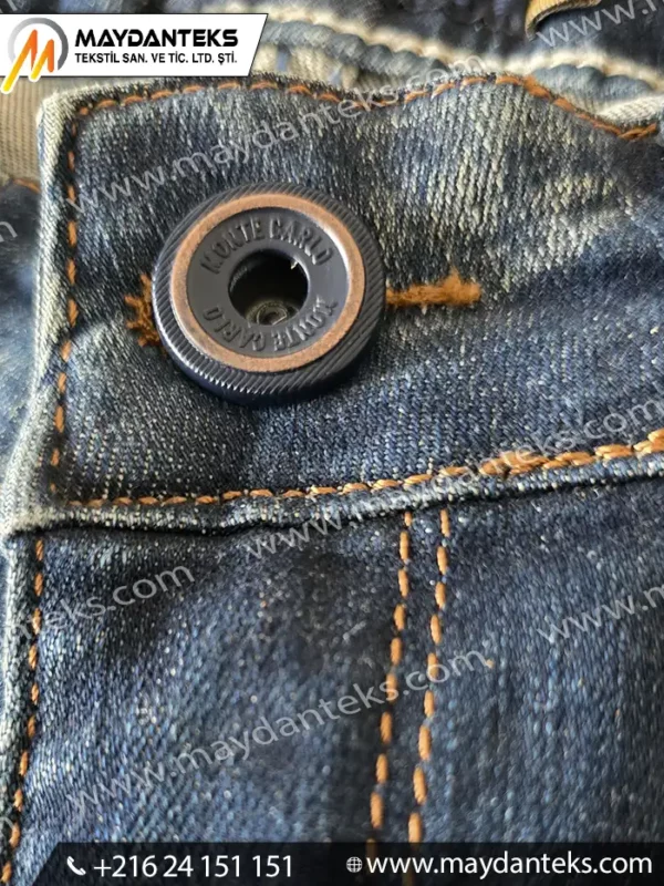Bouton métallique à vis pour jeans avec fixation centrale sur denim