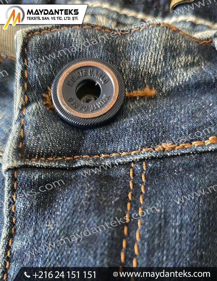 Bouton métallique à vis pour jeans avec fixation centrale sur denim
